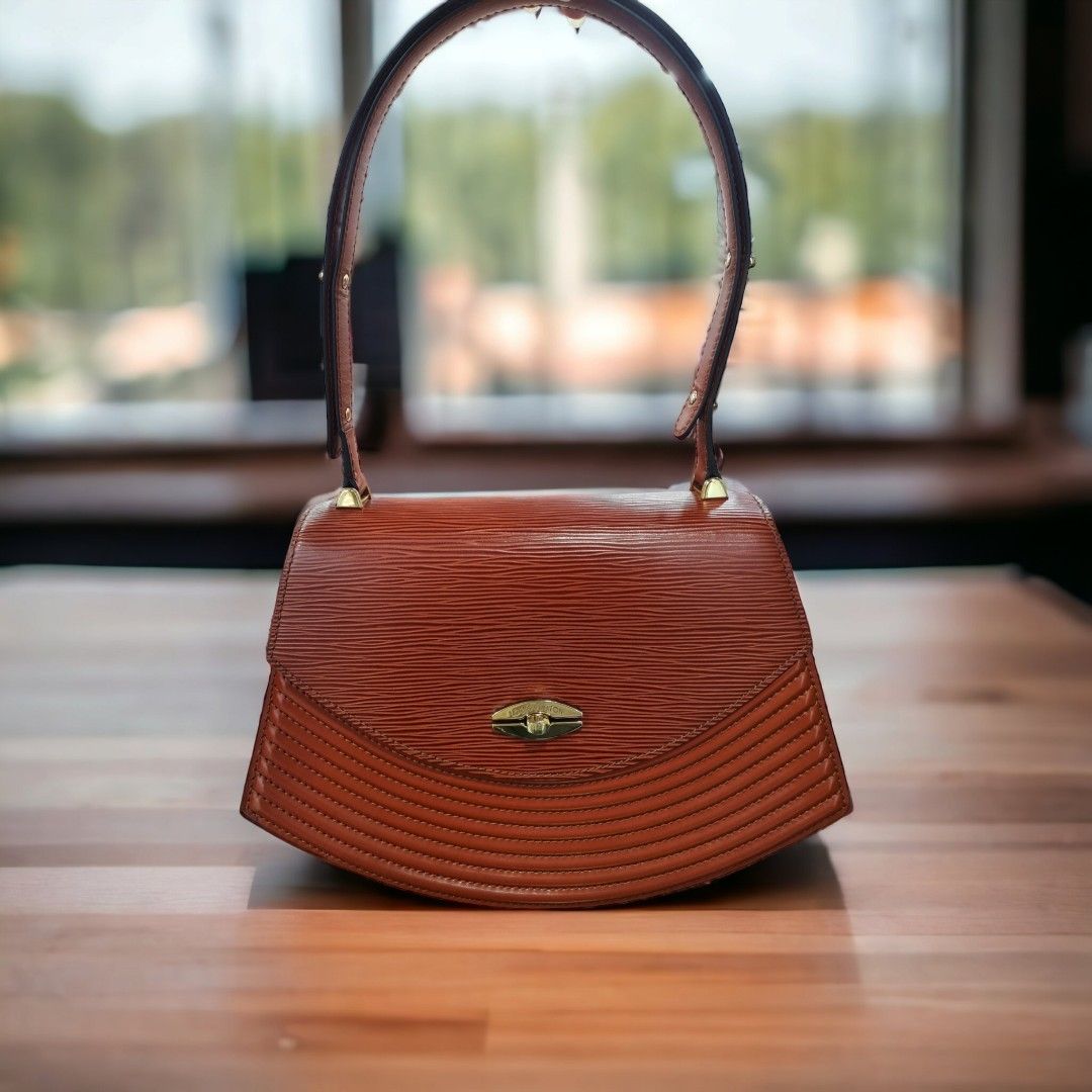 LV Tivoli PM Handbag, Luxury, Bags & Wallets on Carousell