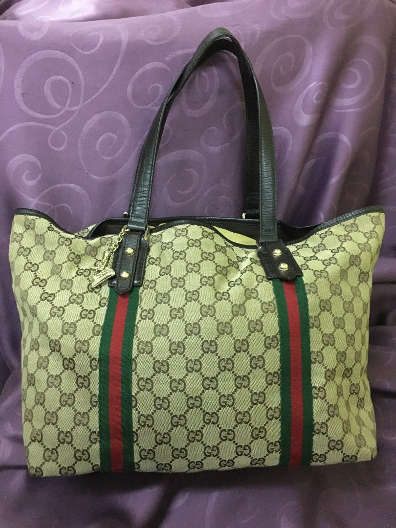 Original GUCCI sherryline medium open shopper tote (Category: Luxury Bags & Wallets) located in Makati City. Submitted by declutteringfor2023 (Listing ID 1225671751, Image 1). Description: Money-back guaranteed Has very small issue , refer to last photo Otherwise in excellent condition Clean inside lining Medium size Very classy GUCCI sherryline .
