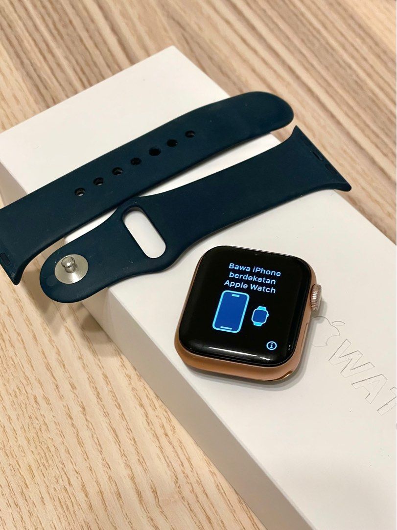 Gold apple watch with navy top band