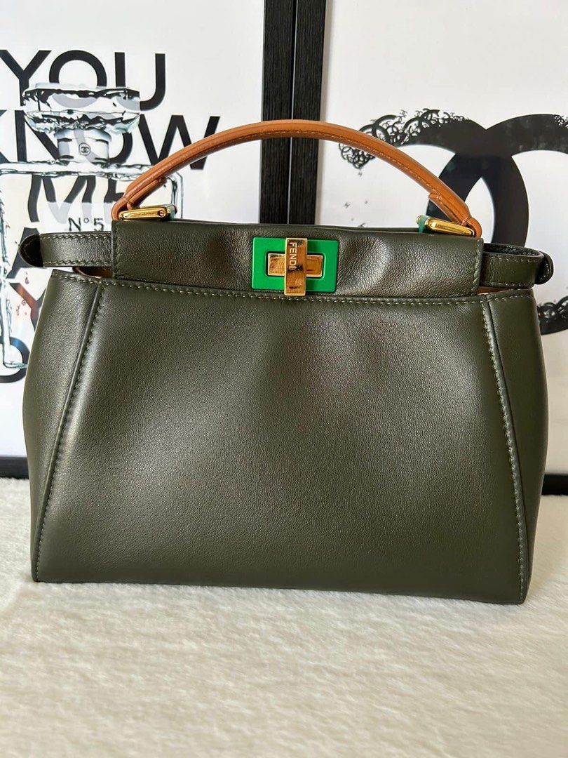 Fendi Mini Peekaboo Bag (Category: Luxury Bags & Wallets) located in Manila. Submitted by bagislifeshop (Listing ID 1229453054, Image 2). Description: ▪️Fendi Mini Peekaboo Bag▪️ ☑️Available in Manila ✅Condition: 8.5/10 ✅Material: Calf leather ✅Colour: Dark olive green in ghw ✅Inclusion: dustbag, cards, raincoat and strap .