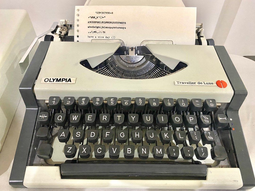 Olympia Traveller de Luxe (Typewriter) (Category: Stationery & School Supplies) located in Baliuag. Submitted by uncannyxgirl (Listing ID 1229606707, Image 1). Description: I bought this online last year for journalling, and it’s in a really good condition. This comes with a case while the typewriter itself has a metal case (very secure). This is almost new cause it was well maintained, gagamitin na lang :)) ✍🏻 ALL KEYS ARE FULLY FUNCTIONING!! ✍