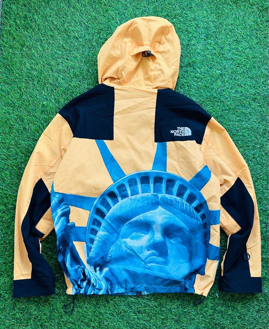 Blue and yellow on sale north face supreme jacket