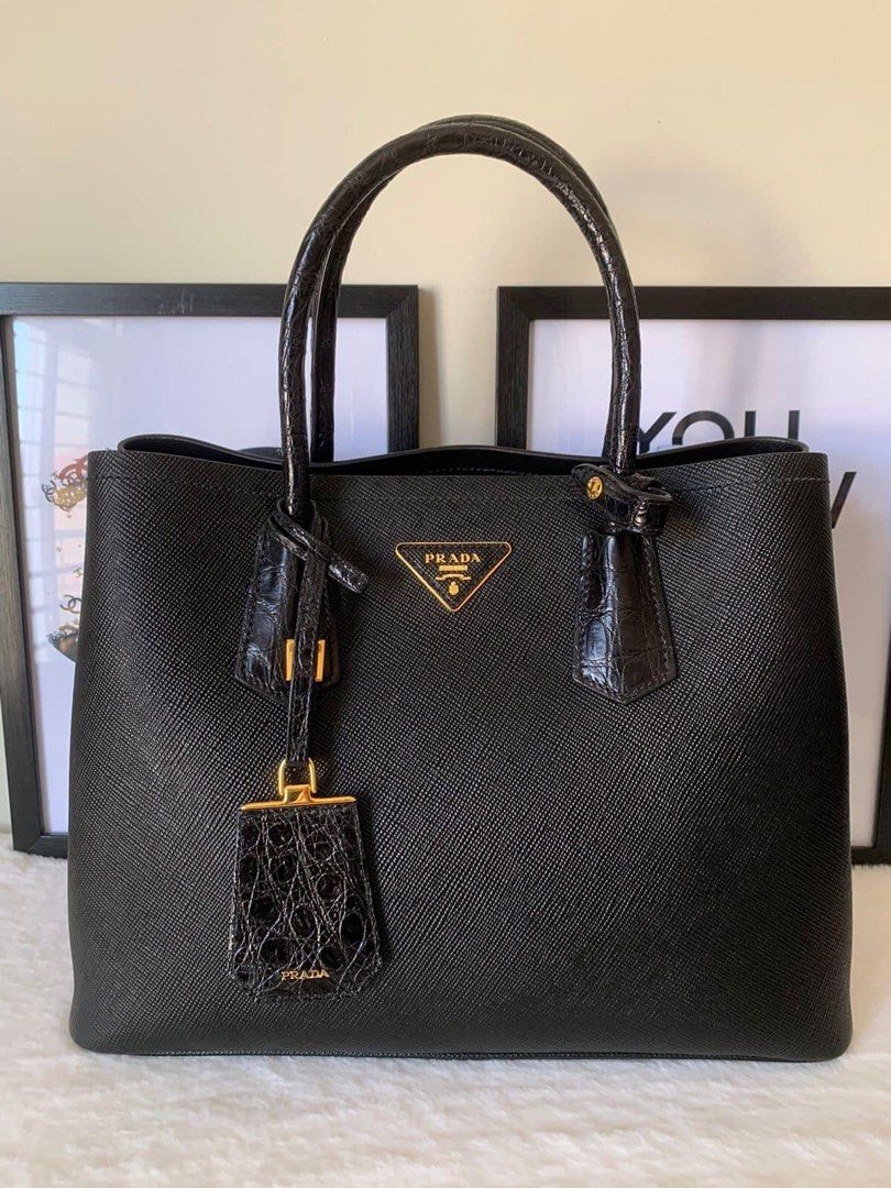 Prada Saffiano Cuir Croc Double (Category: Luxury Bags & Wallets) located in Manila. Submitted by bagislifeshop (Listing ID 1231175141, Image 2). Description: ▪️Prada Saffiano Cuir Croc Double Bag▪️ ☑️Available in Pampanga ✅Model: 1BG775 ✅Condition: 8.8/10 ✅Material: Saffiano and croc embossed leather ✅Colour: Black in GHW ✅Inclusions: Long strap, hang tag and box ✅Retail price: USD4700 .