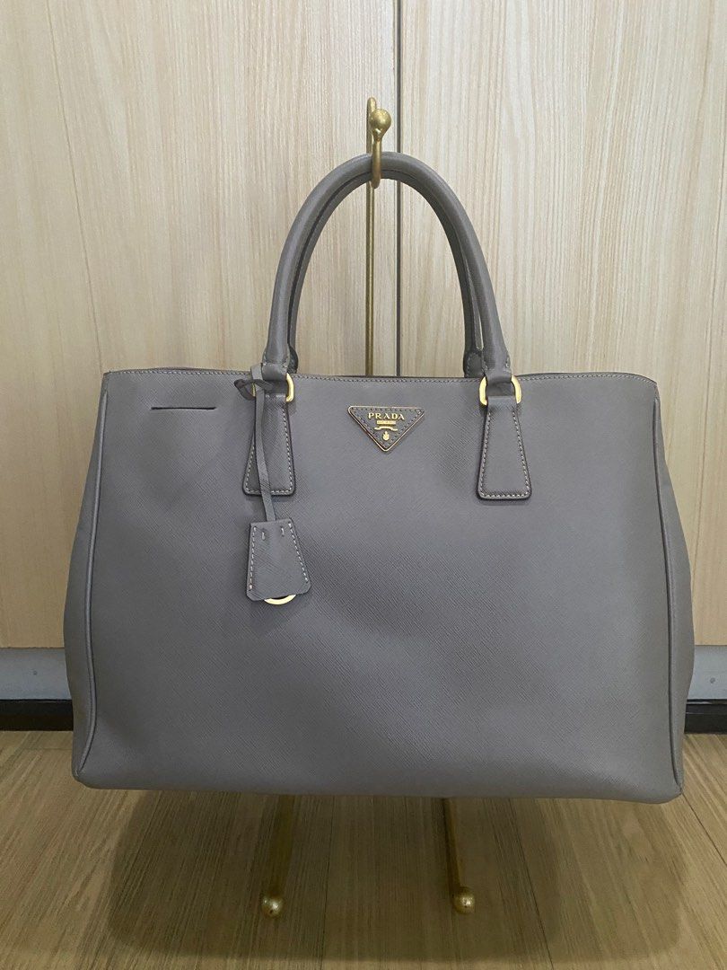 Prada Saffiano Lux Tote Bag (Category: Luxury Bags & Wallets) located in Quezon City. Submitted by tiffngo_cheng (Listing ID 1231150775, Image 3). Description: Prada Saffiano Lux Tote Bag BN 1844 Gray (Argilla) W38 X H25 X D17 CM Bought in Rome RFS- not using.