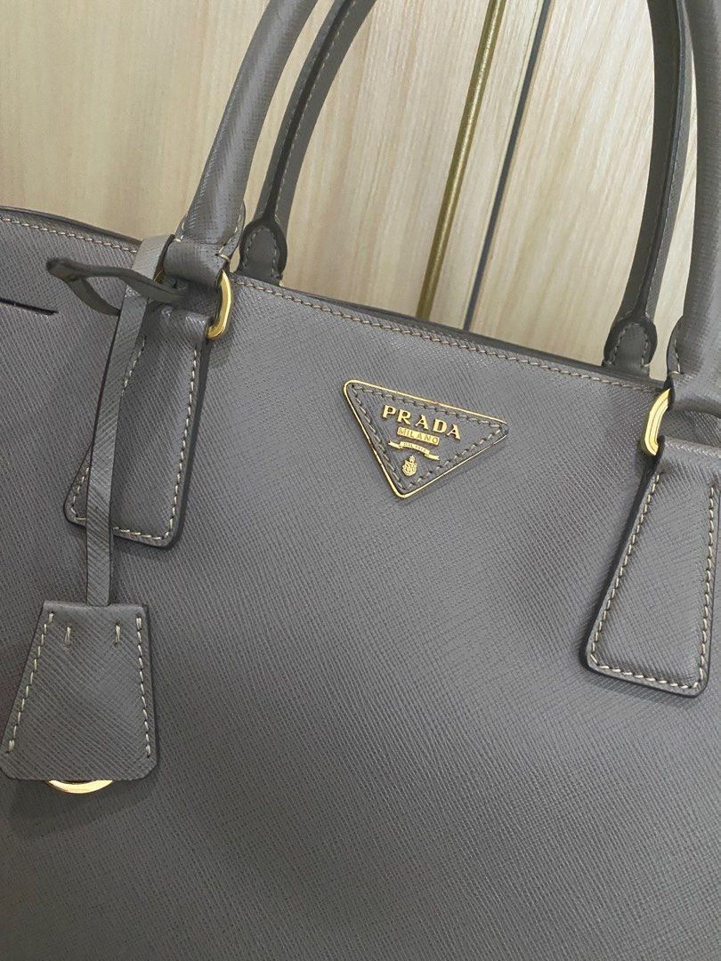 Prada Saffiano Lux Tote Bag (Category: Luxury Bags & Wallets) located in Quezon City. Submitted by tiffngo_cheng (Listing ID 1231150775, Image 2). Description: Prada Saffiano Lux Tote Bag BN 1844 Gray (Argilla) W38 X H25 X D17 CM Bought in Rome RFS- not using.
