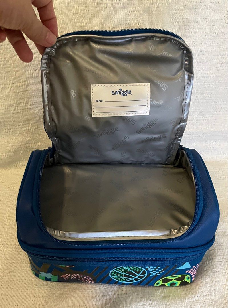 Smiggle Navy Drift Double Decker Lunchbox (Category: Food Organization & Storage) located in Quezon City. Submitted by pia1988 (Listing ID 1231095400, Image 3). Description: Smiggle Navy Drift Double Decker Lunchbox comes with: * BPA-free and food-safe lining * 2 compartments with double zips * carry handle * name label * measures 24.5 cm W x 15 cm H x 15.5 cm D Brand new with tag. Feel free to ask any questions. Salamat.🌸.