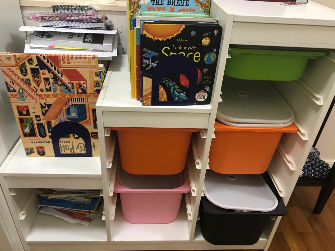 Toy shelf with 2025 buckets