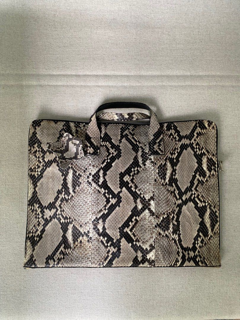 Python brief or computer bag (Category: Briefcases) located in Singapore. Submitted by slowpapa (Listing ID 1231419663, Image 1). Description: A steal : genuine Python leather, need to clear some space, a good fashion item to go to another stylish individual. Price negotiable. .
