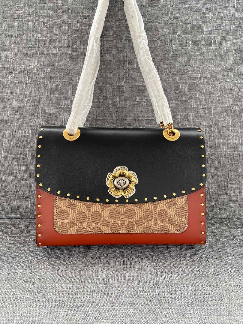 Coach parker with rivets and snakeskin detail top