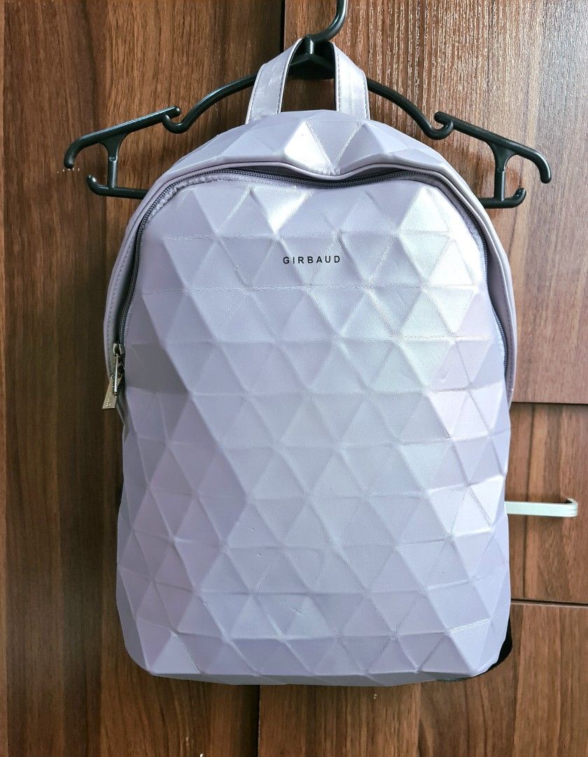Marithé + François Marithe Francois Girbaud Violet backpack (Category: Backpacks) located in Iloilo. Submitted by kajoy99 (Listing ID 1231489906, Image 1). Description: used Once Faux Leather Body Geometric fold print effect Polyester lining Padded back Nylon strap peelings on sides Length: 29 cm Height: 36 cm Width: 10 cm.