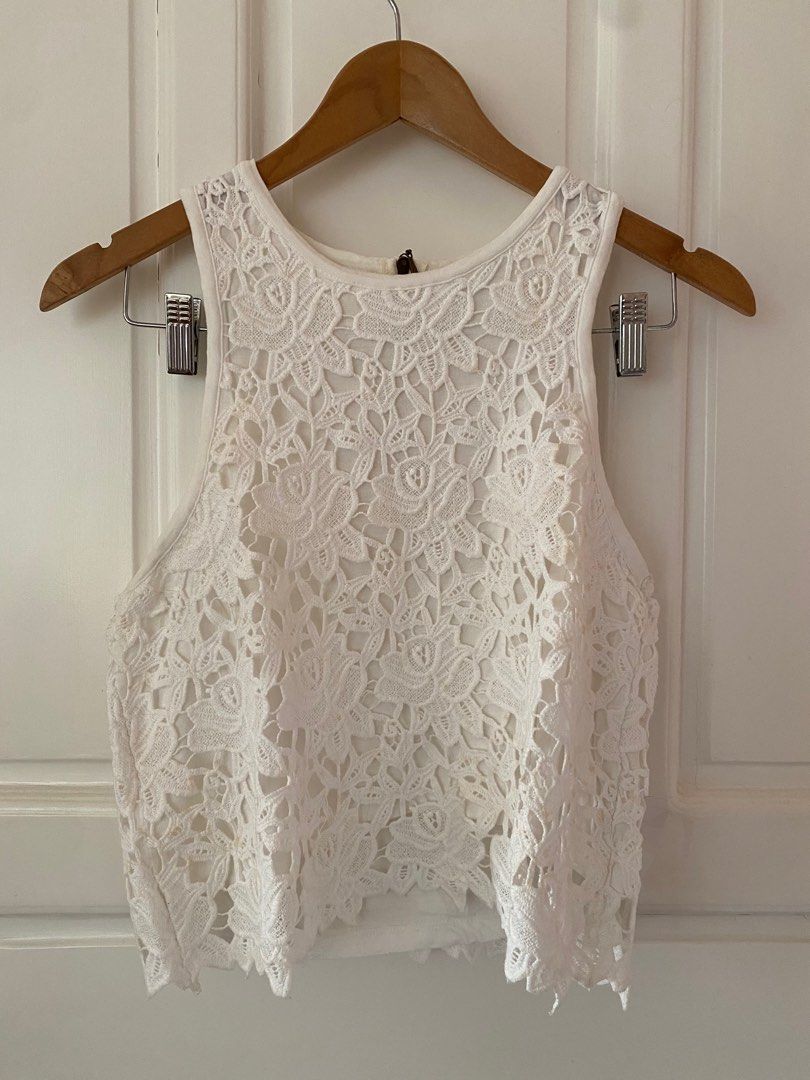 Suiteblanco Sleeveless Lace Crop Top (Category: Blouses) located in Makati City. Submitted by mmivs (Listing ID 1231519755, Image 1). Description: Brand: Suite blanco Size: Large on tag but fits Medium to Large - RFS: Decluttering - White lace design - Back half zipper closure.