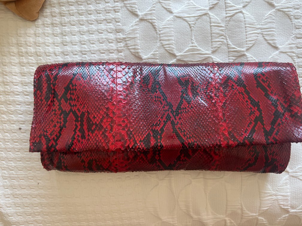 Red snakeskin hotsell clutch bag