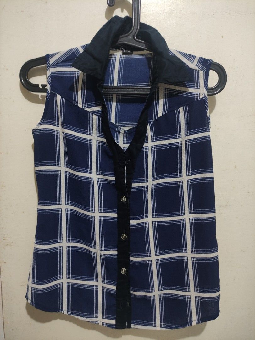 Blue Checkered Sleeveless Blouse (Category: Blouses) located in San Pedro. Submitted by recitea (Listing ID 1231657884, Image 1). Description: I am selling my preloved sleeveless blouse. Very comfortable to use during summer time. Size: Small Flaws:Missing one button. please see 3rd picture.