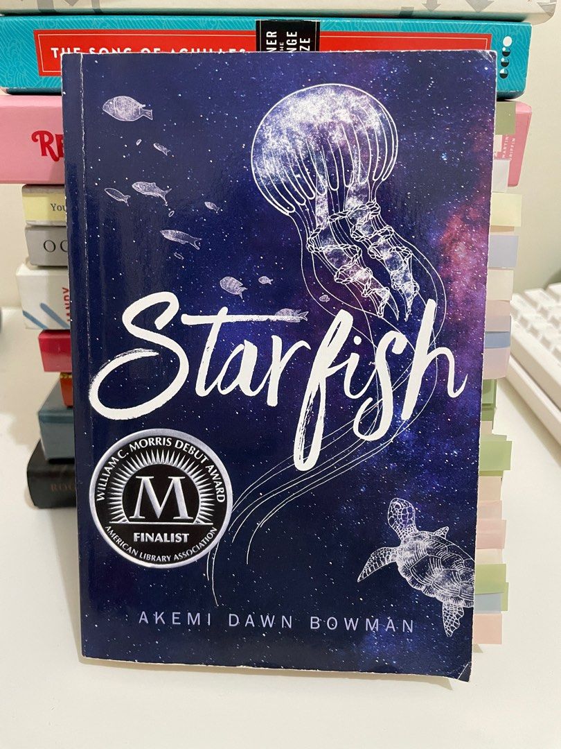 Starfish by Akemi Dawn Bowman (Book, original) (Category: Storybooks) located in Manila. Submitted by prelovedtrish (Listing ID 1231769802, Image 1). Description: Starfish by Akemi Dawn Bowman (personal fav) Format: Paperback Condition: Good condition, no writings/highlights, with tabs PRICE: 429 (bought for 616 all-in at USA pasabuy) Books for sale, photos are my own and all are original / NOT counterfeit or reprints. Most books have their Fully