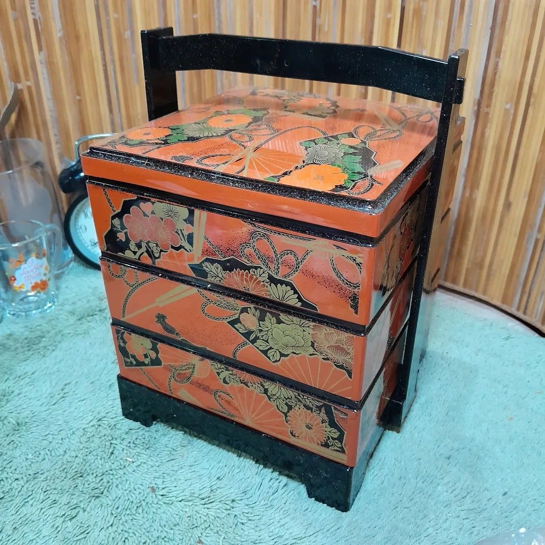 3 Layer Bento Box with Tray and Holder (Category: Storage Boxes & Baskets) located in Malolos. Submitted by jestrelita (Listing ID 1231948574, Image 2). Description: 3 Layer Bento Box with Tray and Holder P250 only - a combination of black, orange, and gold design - brand new with small chips at the bottom layer (see photos, still reusable) - good condition 🇯🇵🏯👘👺🗾🍱🎎🍜🍙.