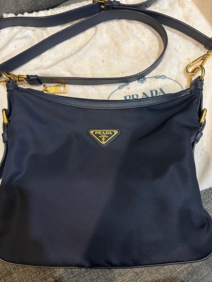 Prada navy blue nylon sling bag, Luxury, Bags & Wallets on Carousell