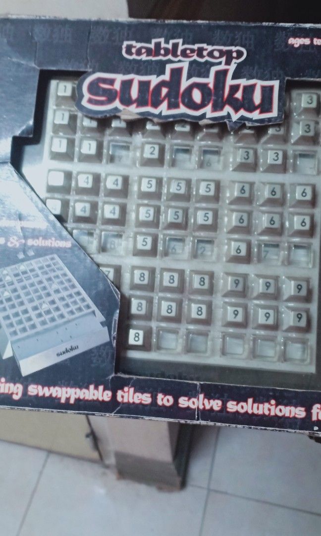 Tabletop sudoku (Category: Board Games & Puzzles) located in Muntinlupa City. Submitted by jettttttttt (Listing ID 1231913570, Image 1). Description: box is heavily damaged due to storage but the item itself is in good condition. decluttering.