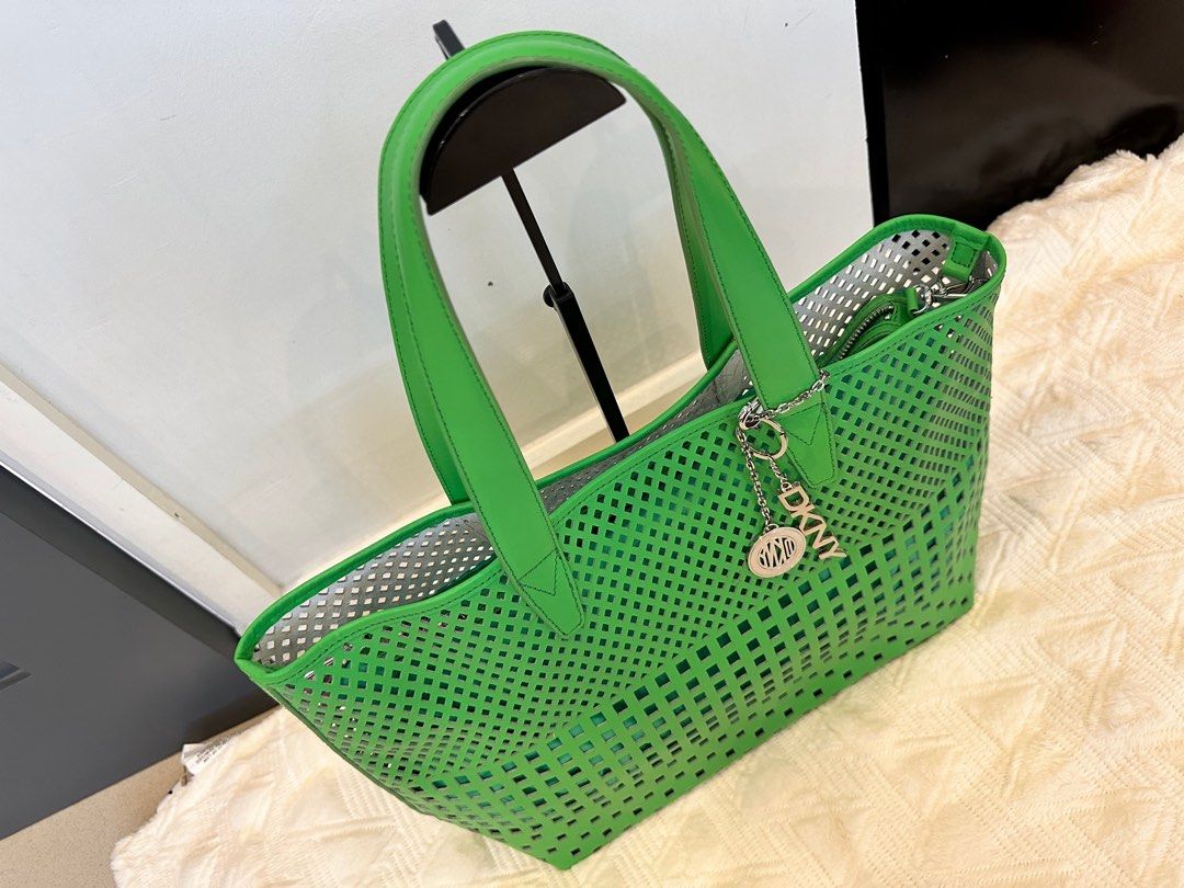 DKNY Tote bag Green (Category: Luxury Bags & Wallets) located in Pasig City. Submitted by closetqueen8888 (Listing ID 1232133338, Image 3). Description: DKNY Green tote bag Like New With attached pouch inside Perfect beach bag 😍 Price: 5,500 + SF.
