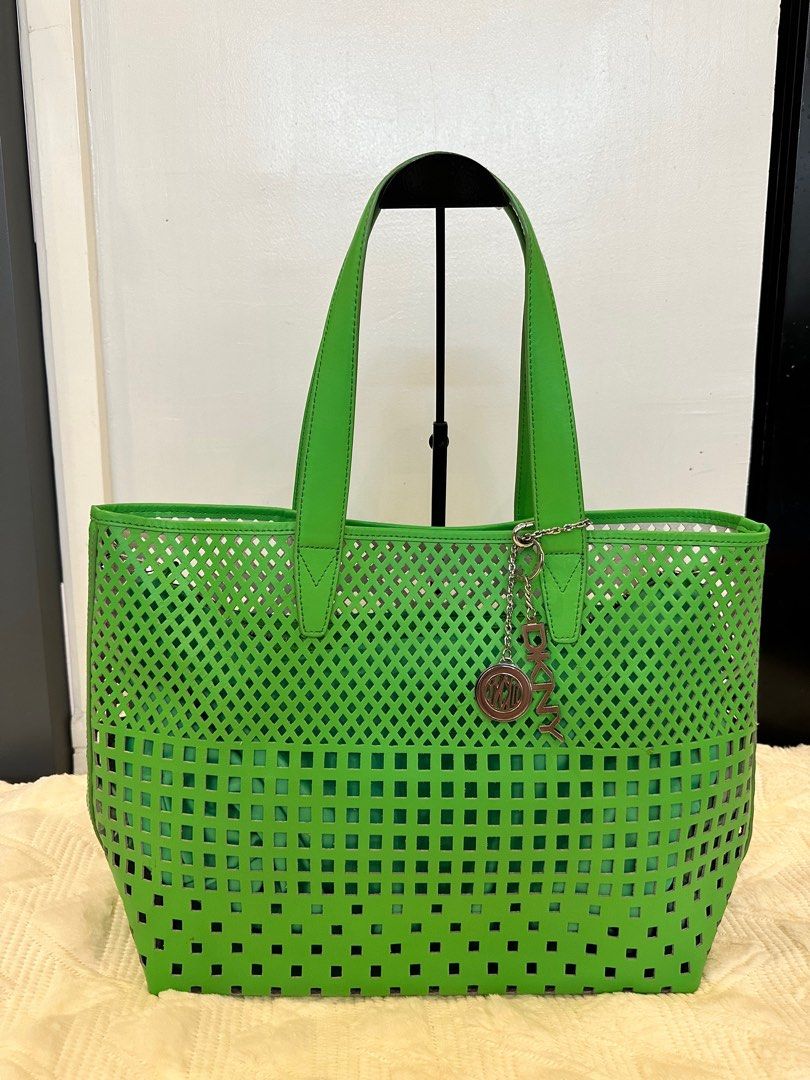 DKNY Tote bag Green (Category: Luxury Bags & Wallets) located in Pasig City. Submitted by closetqueen8888 (Listing ID 1232133338, Image 1). Description: DKNY Green tote bag Like New With attached pouch inside Perfect beach bag 😍 Price: 5,500 + SF.