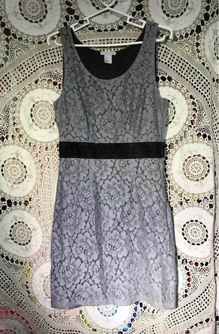 H&M lace dress (Category: Dresses) located in Quezon City. Submitted by bingblings (Listing ID 1232130616, Image 1). Description: H&M gray sleeveless straight. Dress in lace material. Fits medium..