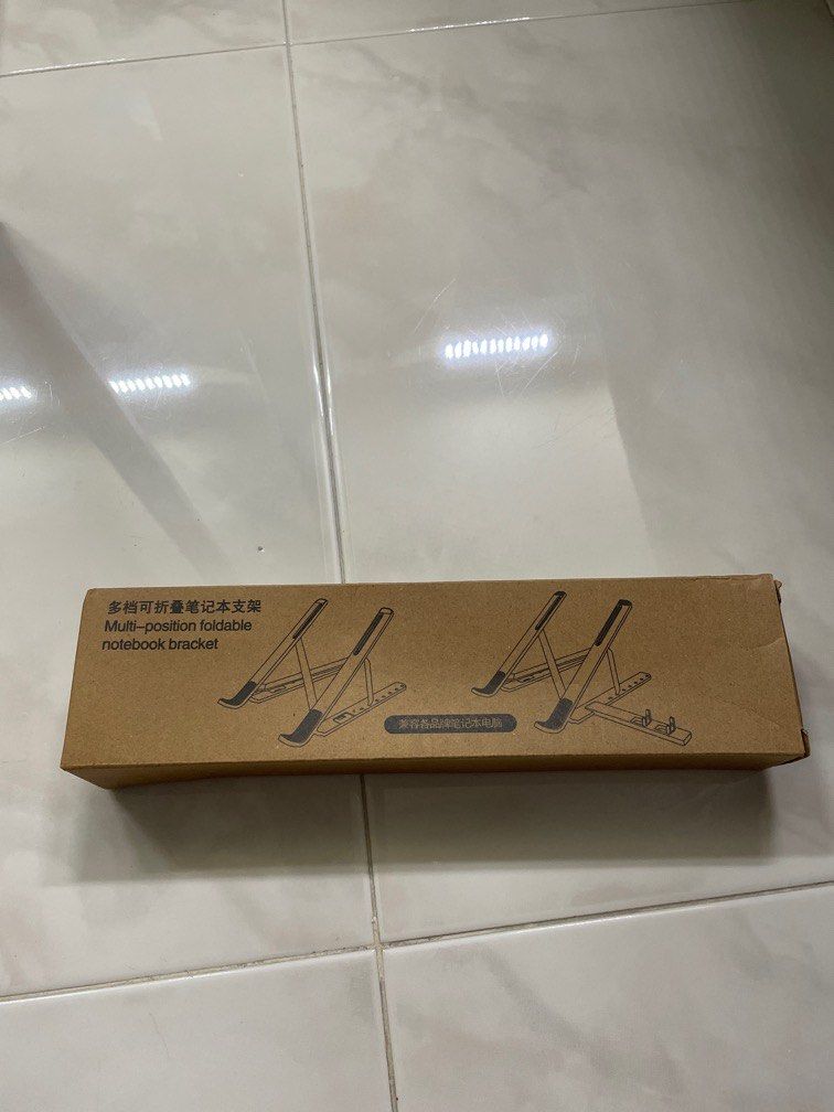 Multi-Position Foldable Notebook Bracket (Category: Laptops & Notebooks) located in Singapore. Submitted by stef25 (Listing ID 1232088776, Image 1). Description: .