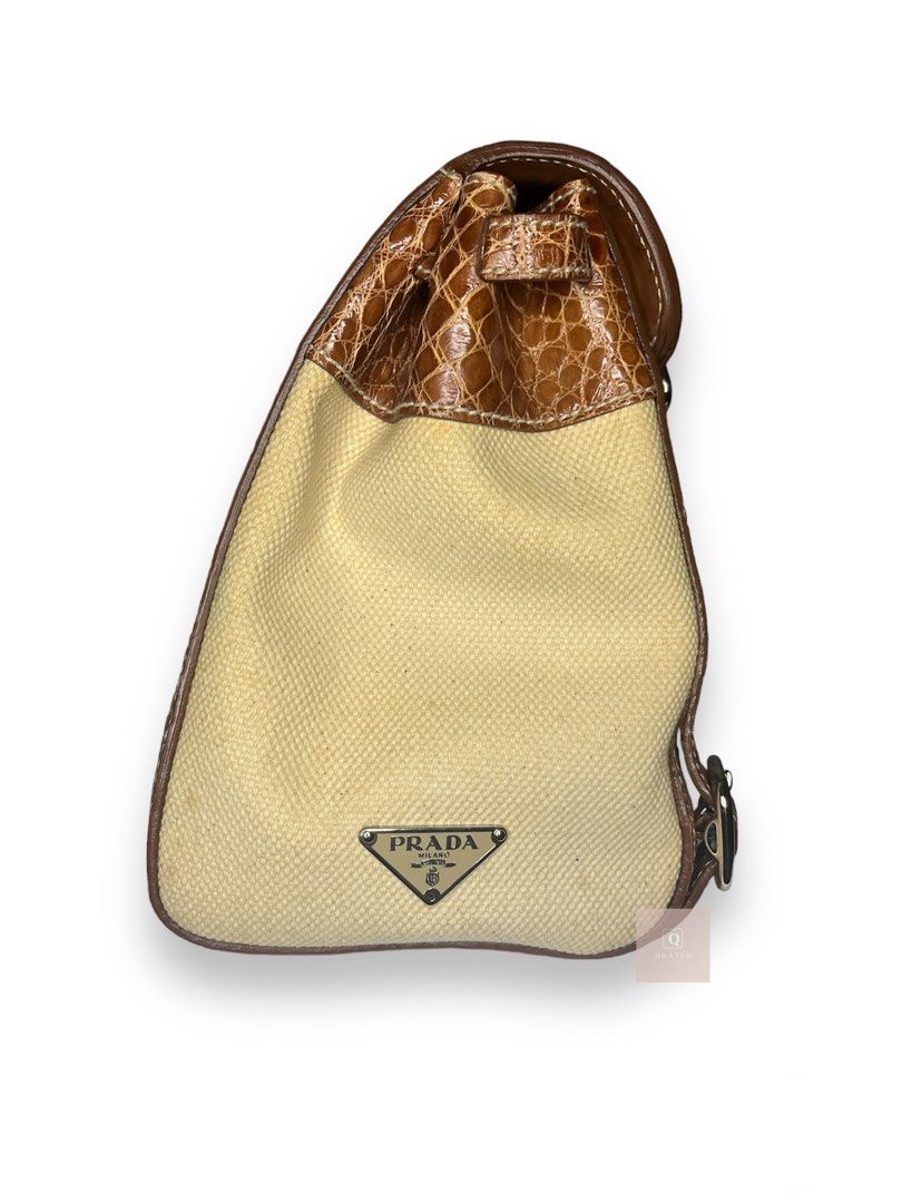 Prada shoulder bag canvass and leather (Category: Luxury Bags & Wallets) located in Manila. Submitted by Qratedph.pieces (Listing ID 1232112257, Image 3). Description: Prad.a shoulder bag canvass and leather (like Herbag) Rank AB, small stain at the back, split leather No inclusion Php 8,500 *color may vary due to lighting Disclaimer: Qratedph.pieces is not associated or affiliated with the brands featured. All copyrights and trademarks reserved 