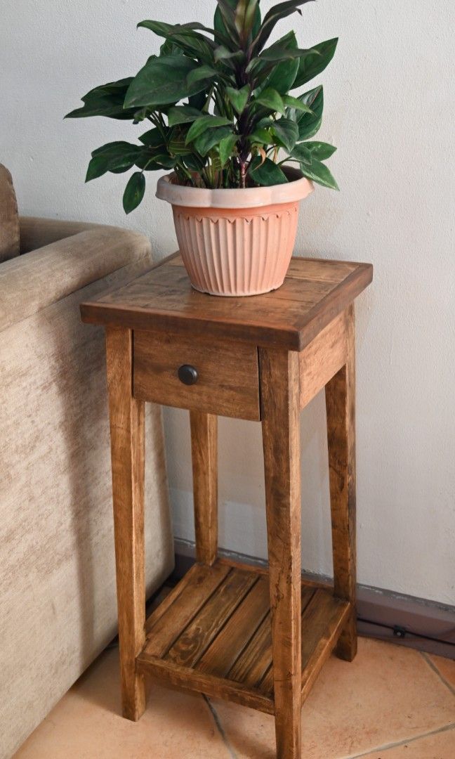 Side/stand table, rustic, vintage inspired, recycled wood. (Category: Tables & Sets) located in Manila. Submitted by herich65 (Listing ID 1232022686, Image 1). Description: A unique accent side table for your indoor plant, telephone or for a lamp shade by your bedside,with a drawer using solid metal handle. Made from recycled wood,4x4cm solid legs with an original design, distress natural finish using quality furniture wax. Measurements: 32x32x75