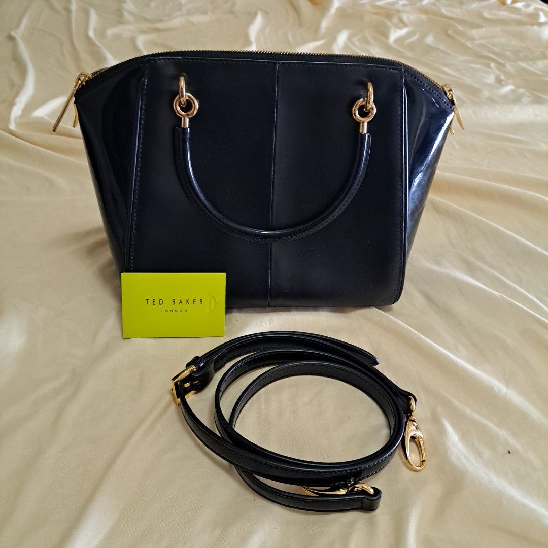 Authentic Ted Baker Lailey Slim Bow (Category: Luxury Bags & Wallets) located in Quezon City. Submitted by lixire (Listing ID 1231995952, Image 2). Description: Bought from Ted Baker store in HK. Used for 1 or 2 times and has been in the closet since. Complete with card and sling. With a scratch in the leather.