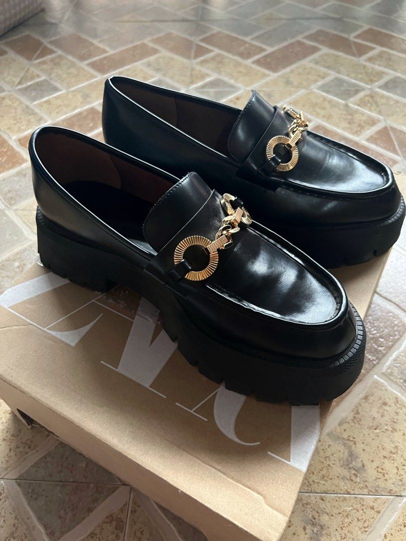 Black Chunky Platform Loafers with Chain (Zara) (Category: Loafers) located in Manila. Submitted by unacore (Listing ID 1232218024, Image 1). Description: Bought from Zara at PHP3,495. Used only once at Harry Styles’ Concert. Has some slight creases but still in really good condition! Size is Women’s EU 40, heel height is 1’9 inches. (Im usually a size 9 and it fits me perfectly). Price negotiable DM me your offers! Comes with Zara dustbag and bo