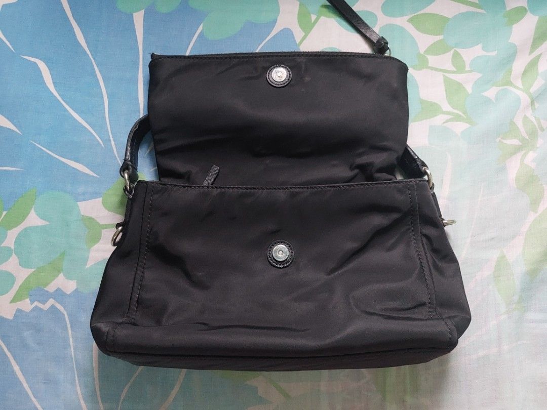 Kate Spade (Category: Luxury Bags & Wallets) located in Valenzuela. Submitted by trislndgn (Listing ID 1232237932, Image 3). Description: Kate Spade Miri Nylon Crossbody Bag Like new, only flaw lang is sa handle but very minimal lang, pwedeng lagyan ng twilly, or ipagawa kay mr quickie 🙂 Steal price for 2600, original price around 7k, see last photo for the flaw! 🙂.