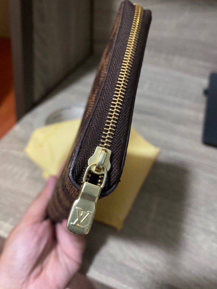 LV zippered bi fold wallet damier (Category: Luxury Bags & Wallets) located in Las Pinas. Submitted by 2021privateshopper (Listing ID 1232278578, Image 3). Description: LV Damier zippered wallet Brandnew. Stores closet lang and never used Minor flaw sticky part sold as is see last pic but minimal naman .