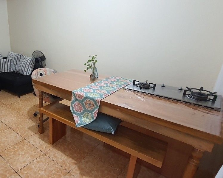 Mahogany Wood Islander Dining Table Set with Cook Top (Category: Tables & Sets) located in Quezon City. Submitted by tipidiety (Listing ID 1232167686, Image 2). Description: Mahogany Wood Dining Table Set with Cook Top Features and inclusion: 📌Custom built 📌Table top wood measures 6ft L x 3ft W x 2 in thick 📌Table height is 33in 📌1 Long Bench 📌1 Short Bench 📌3 Islander Legs 📌1 gas storage/cabinet 📌Double Burner Rinai Cook Top (Igniter on 