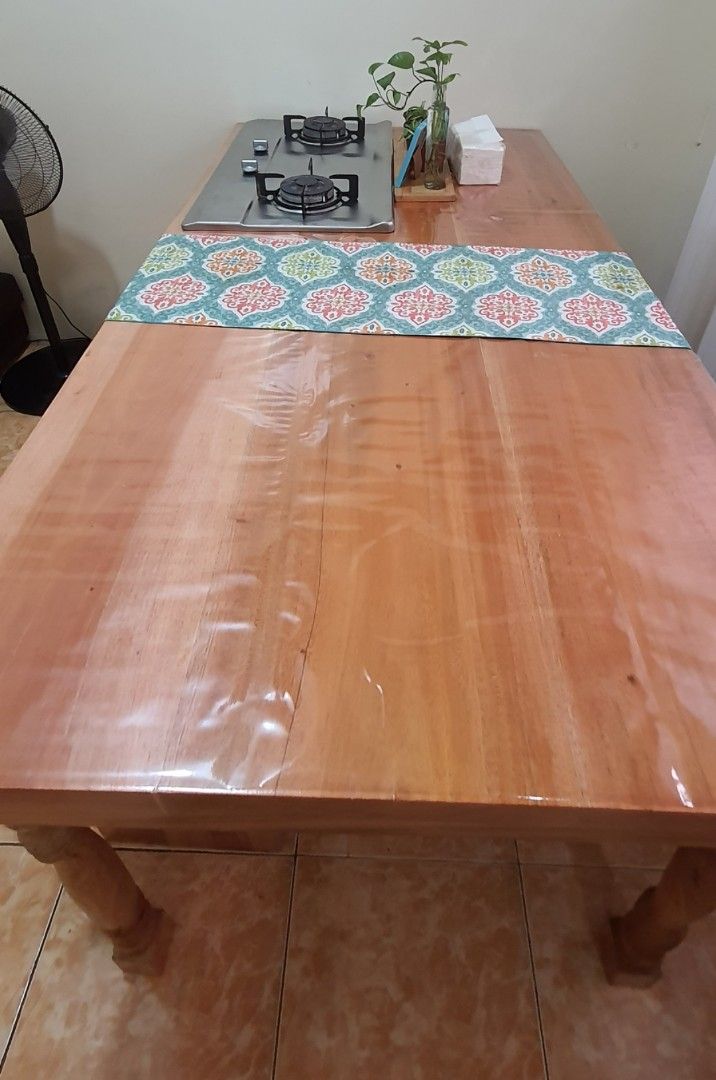 Mahogany Wood Islander Dining Table Set with Cook Top (Category: Tables & Sets) located in Quezon City. Submitted by tipidiety (Listing ID 1232167686, Image 3). Description: Mahogany Wood Dining Table Set with Cook Top Features and inclusion: 📌Custom built 📌Table top wood measures 6ft L x 3ft W x 2 in thick 📌Table height is 33in 📌1 Long Bench 📌1 Short Bench 📌3 Islander Legs 📌1 gas storage/cabinet 📌Double Burner Rinai Cook Top (Igniter on 