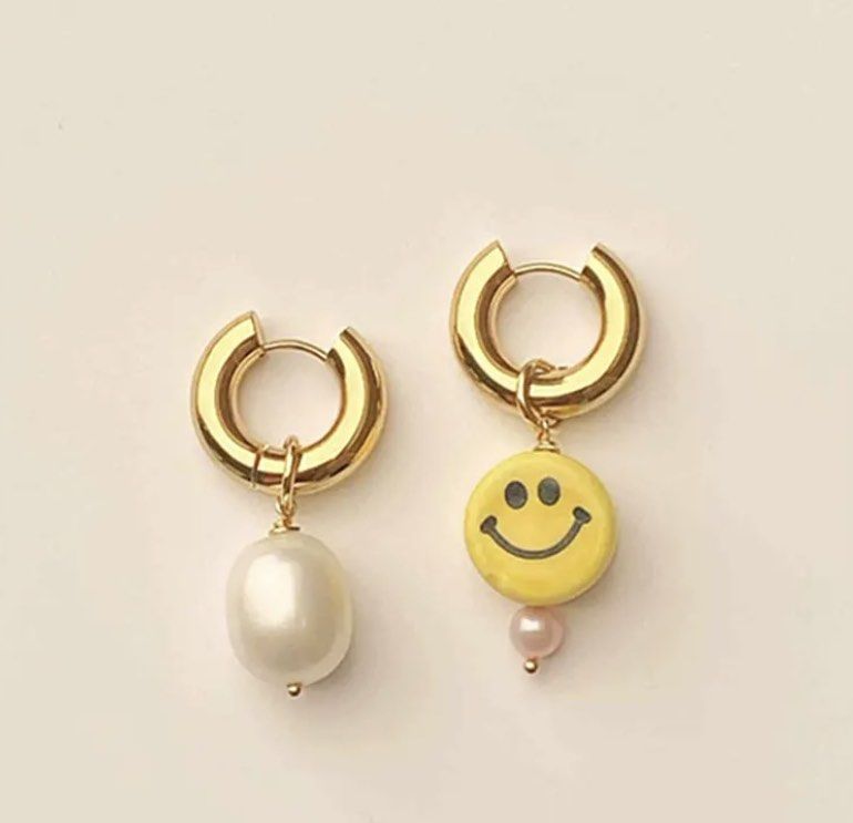 Gold on sale face earrings