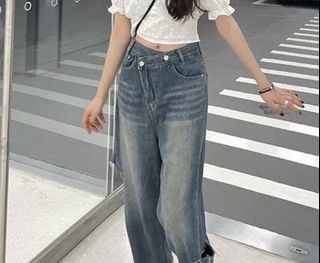 asymmetric button light wash baggy jeans