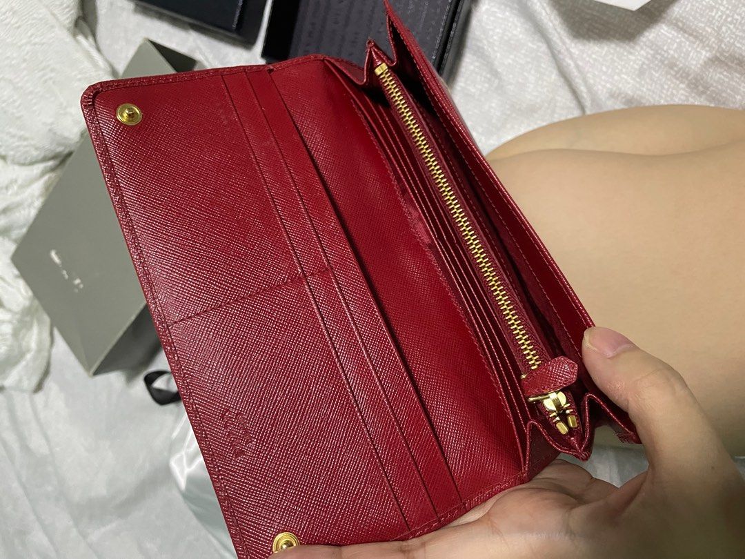 Prada wallet (Category: Luxury Bags & Wallets) located in Taguig. Submitted by pamraq (Listing ID 1232396826, Image 3). Description: Prada wallet Red Bi-fold Complete with box and care cards.