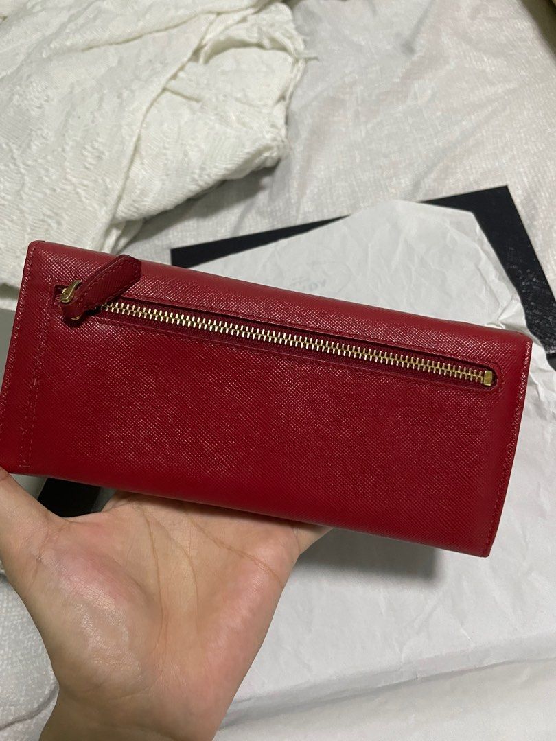 Prada wallet (Category: Luxury Bags & Wallets) located in Taguig. Submitted by pamraq (Listing ID 1232396826, Image 2). Description: Prada wallet Red Bi-fold Complete with box and care cards.
