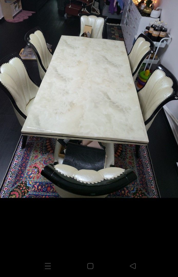 Solid Marble Table (Category: Tables & Sets) located in Singapore. Submitted by ndbsh (Listing ID 1232412680, Image 1). Description: Marble Table with 4 chairs.But can use for 6 chairs So i bought another 2 extra chairs.Look still new and very solid. Take Note :1 extra chair is chip out a bit.see picture.But that chair is an extra chair we bought.