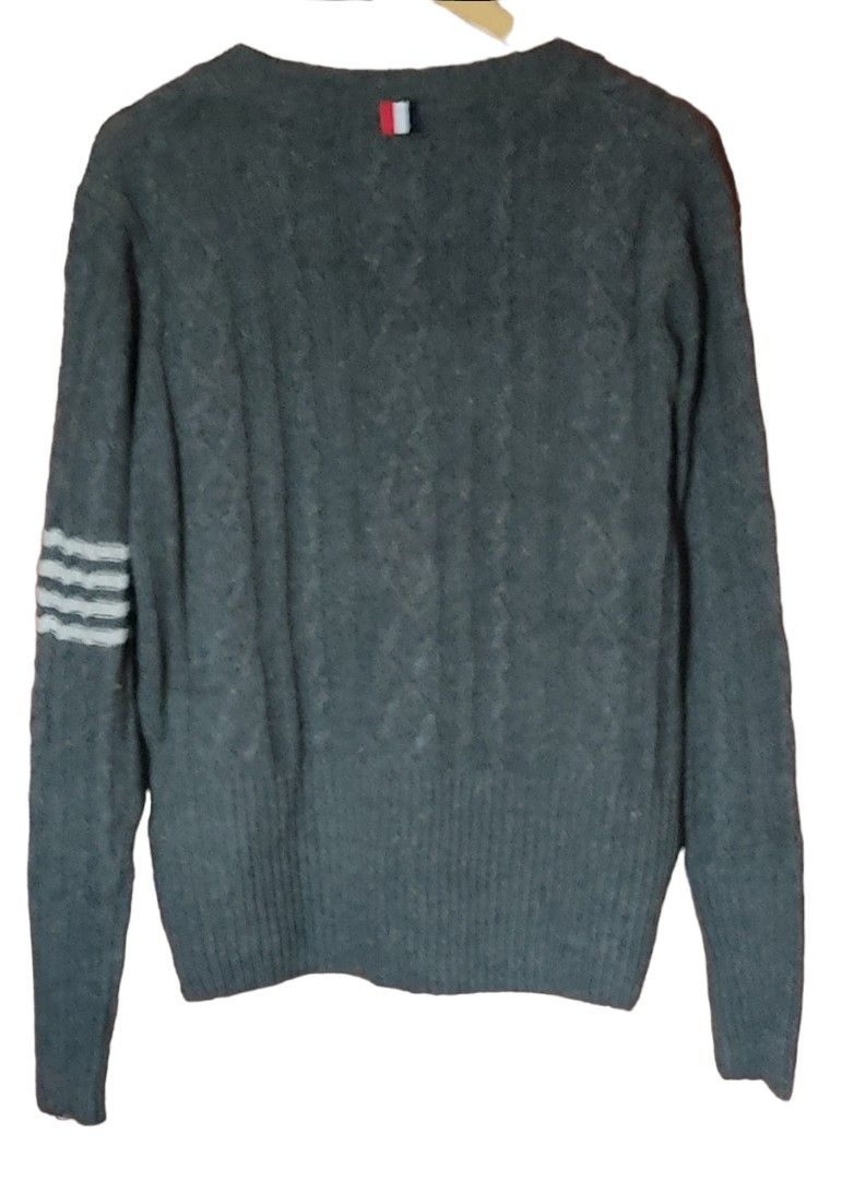 Thom Browne cardigan (Category: Luxury Apparel) located in Las Pinas. Submitted by 05.11minimalist (Listing ID 1232420367, Image 2). Description: Thom Browne v-neck cardigan. Grey. Size 2 on tag. Made in Japan. Dimensions: 22"W x 27"L. Sleeves: 22". Front button closures. Tight hem and wrist cuffs. No fluffings. No runs, rips or holes. In very good condition..