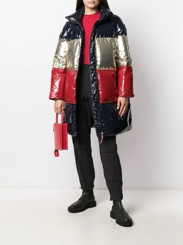 Tommy Hilfiger Color Block Padded Coat (Category: Coats, Jackets and Outerwear) located in Baguio. Submitted by THRIFThingWars (Listing ID 1232372403, Image 1). Description: Chest: 25 Length: 37.5 - desert sky/gold/Arizona red - feather down - colour block - padded - stand-up collar - front zip fastening - long sleeves - logo plaque at the arm - horizontal stripe pattern - two side zip-fastening pockets - straight hem - full lining Composition Li
