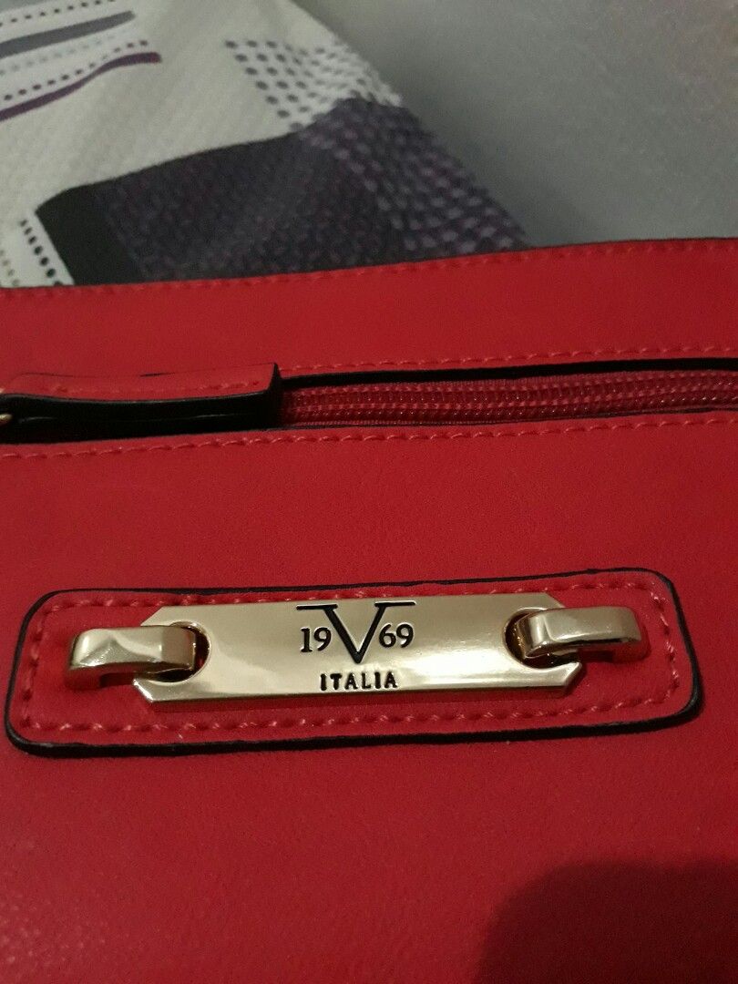 Versace Wrist Wallet (Category: Luxury Bags & Wallets) located in Legazpi City. Submitted by buyfrommaria (Listing ID 1232417315, Image 2). Description: Preloved Versace 19V69 Red Wrist Wallet. Still in great condition. Payment first basis thru gcash or bank transfer. Shipping thru LBC. Shipping c/o buyer.
