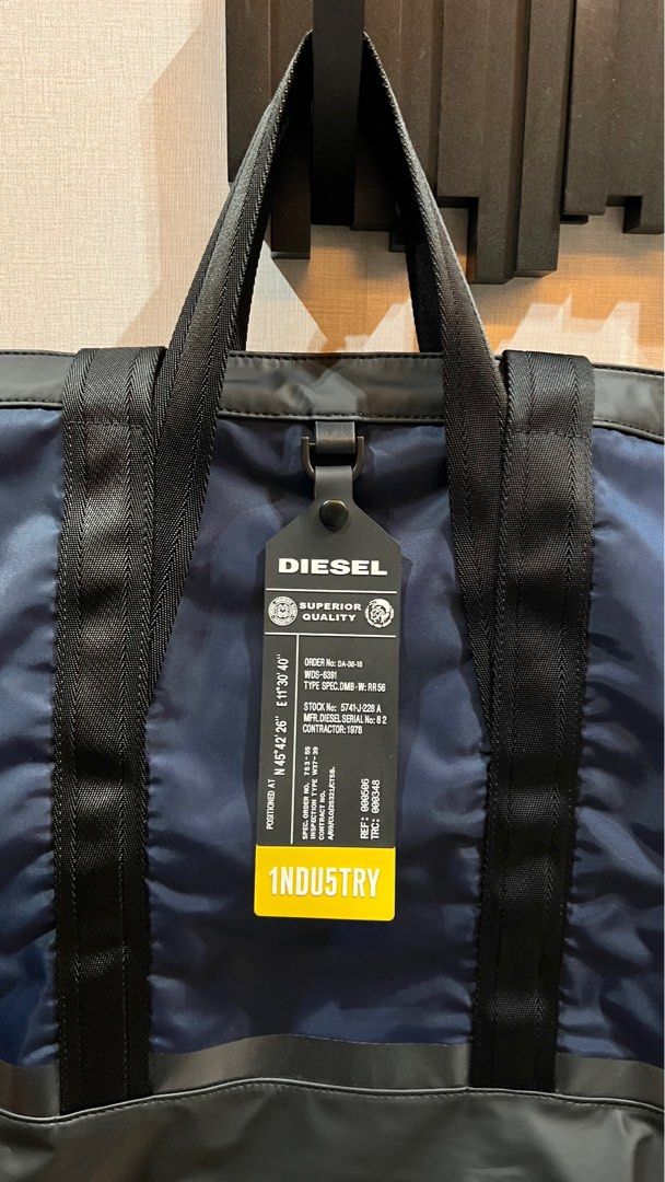 Diesel 3-way bag (tote bag, backpack, sling) (Category: Sling Bags) located in Pasig City. Submitted by ryester (Listing ID 1232647538, Image 2). Description: Authentic Diesel 3-way bag. Can be worn either as a tote bag, backpack, or a sling bag. Never used, everything is still in mint condition, no visible scratches or defects. Approximate size: height 16”, width 18”, depth 5.5”.