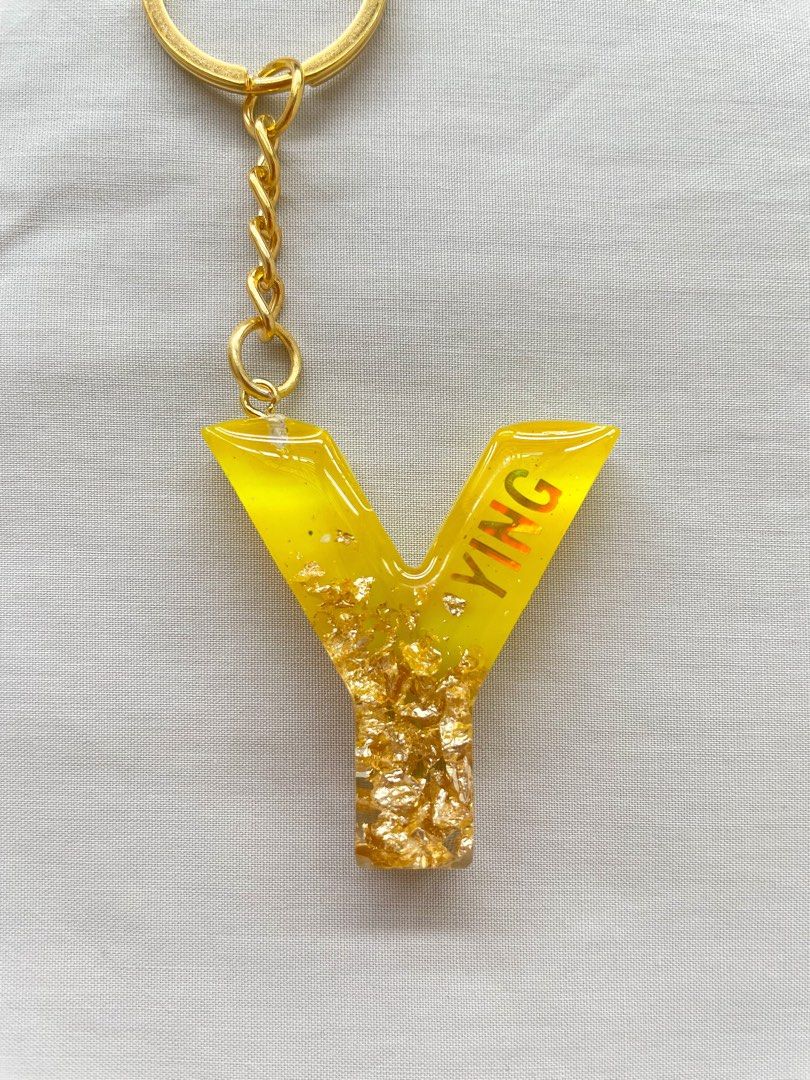 Gold letter new arrivals keychain