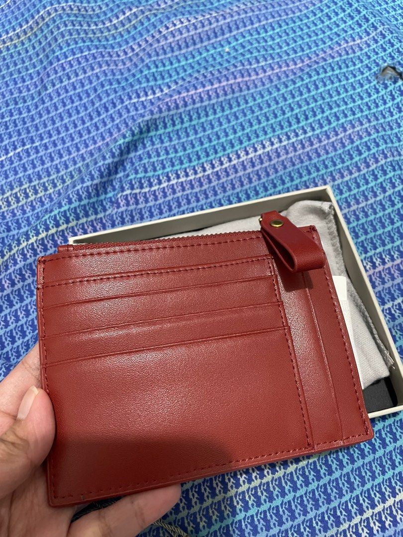 Charles and Keith Multi-Slot Cardholder (Category: Wallets & Card holders) located in Quezon City. Submitted by pattyeval (Listing ID 1232701480, Image 2). Description: Bought at Charles and Keith SM North, with receipt and tags Can fit alot of cards, cash and coins Color: Brick or may pagka burgundy Retail price: 1399 Selling price: 1000 (FIXED) Fixed Price, no to low ballers.