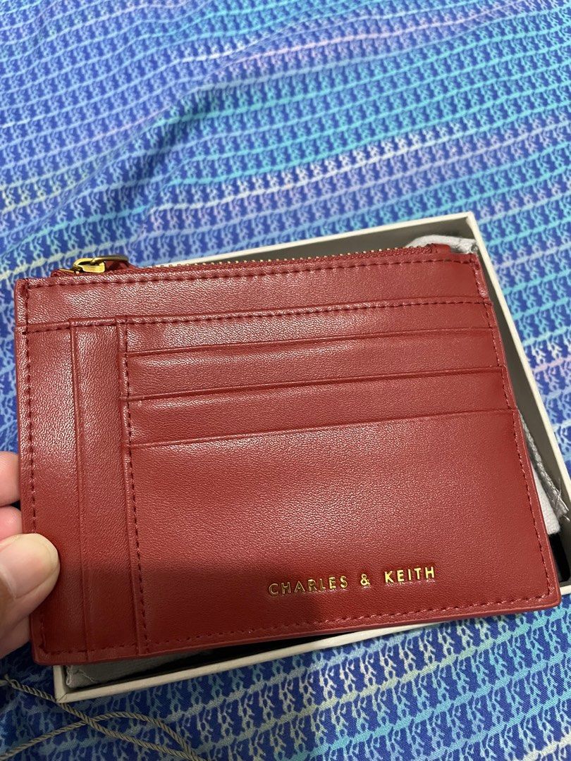 Charles and Keith Multi-Slot Cardholder (Category: Wallets & Card holders) located in Quezon City. Submitted by pattyeval (Listing ID 1232701480, Image 1). Description: Bought at Charles and Keith SM North, with receipt and tags Can fit alot of cards, cash and coins Color: Brick or may pagka burgundy Retail price: 1399 Selling price: 1000 (FIXED) Fixed Price, no to low ballers.