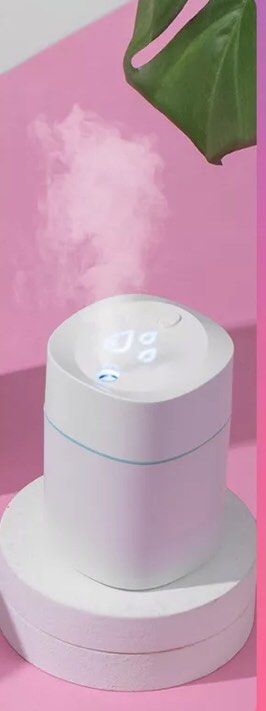 SALE Mini portable humidifier mist essential oil diffuser (Category: Air Purifiers & Dehumidifiers) located in Manila. Submitted by theconstantdeclutterer (Listing ID 1232608970, Image 2). Description: Old stock but tested. USB powered white humidifier essential oil mist diffuser. With free cotton swab. 220ml capacity. Benefits breathing, moisturizes face and add moisture to dry air. Has minor inner stains and filter is taped up but overall works