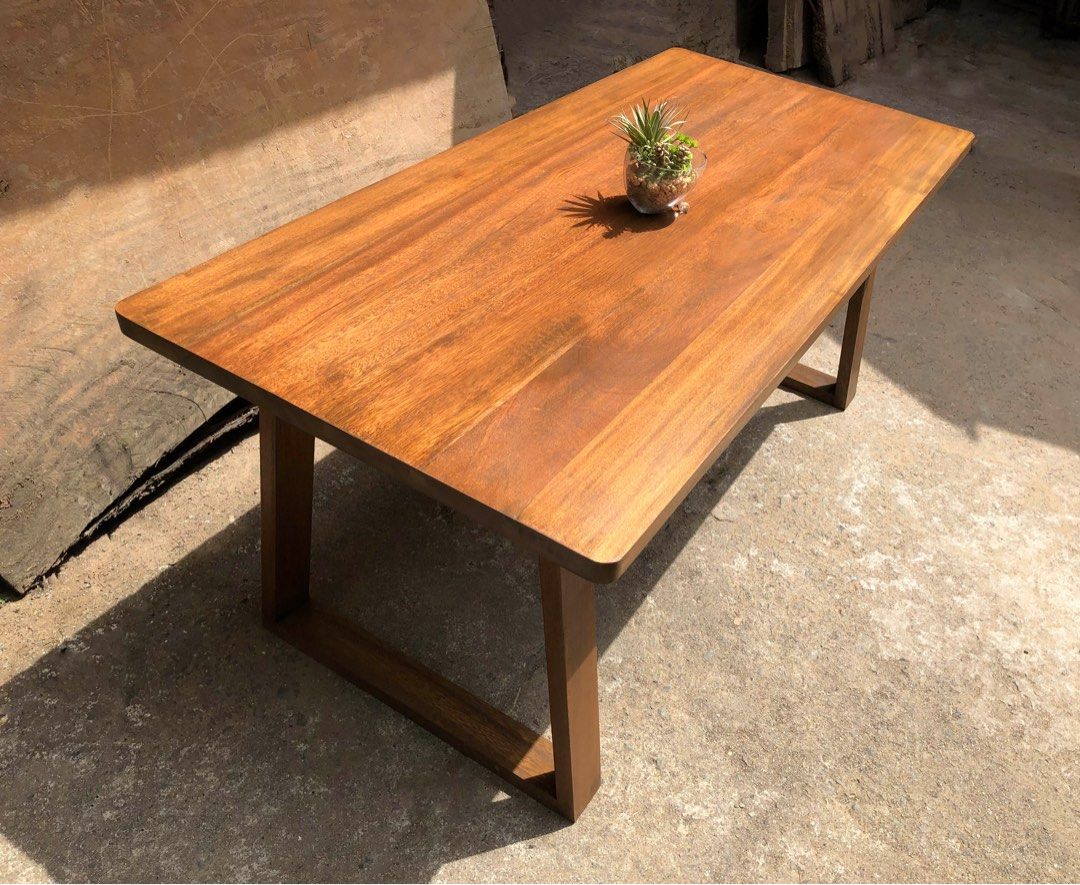 Modern Hardwood Dining Table (Category: Tables & Sets) located in Pasig City. Submitted by holzph (Listing ID 1232790256, Image 1). Description: Showcasing our modern designed piece. This solid wooden Mahogany table sits 6 people. 🌳 Table Measurements: Length: 180cm / 5’11” Width: 84cm / 33” Height: 74cm / 30” Thickness: 3.8cm / 1.5” Our table & benches can be customized based on your requirements. . . 100% Mahogany Wood 🌳 First come, first ser