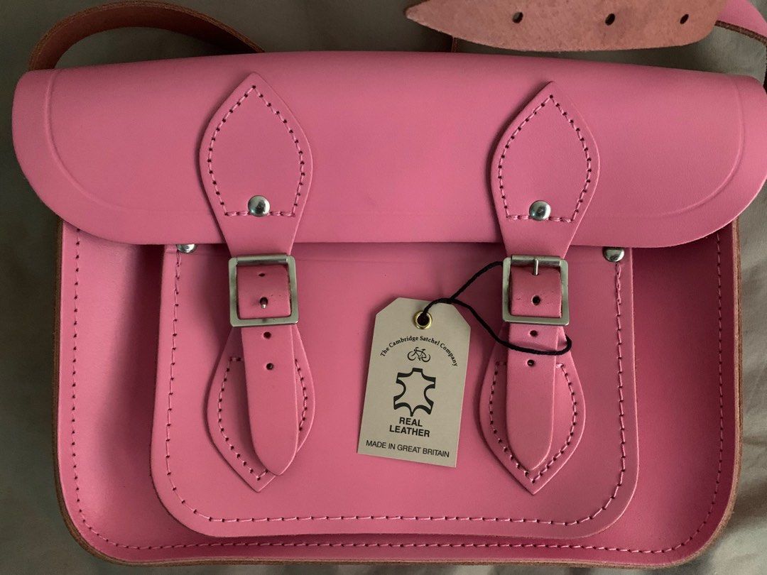 Cambridge Satchel bag (Pink) (Category: Luxury Bags & Wallets) located in Makati City. Submitted by shop.y5 (Listing ID 1158367271, Image 2). Description: -Authentic -Real leather -Brand new with tags -Just got stored hence its minimal flaws (creasing in buckle area and darker leather at back side) see last photo -Original Price: £200 *Negotiable for sure buyers* Selling low!.