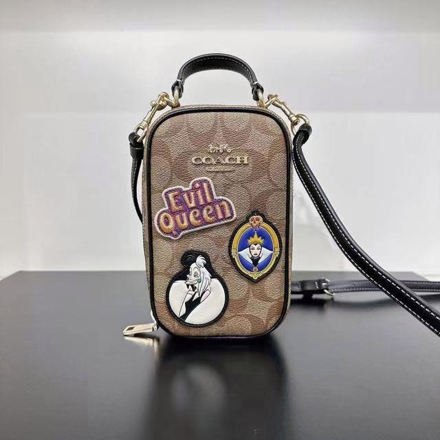 Coach Outlet Disney X Coach Eva Phone Crossbody In Signature Canvas With  Patches in Metallic
