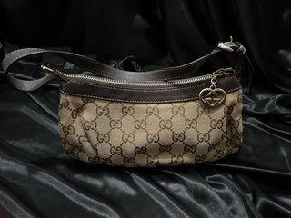 GUCCI POCHETTE SHOULDER HANDBAG, GG monogram canvas with metallic dust pink  leather trims and handle, pale gold hardware, top zip closure with logo  charme, brown fabric lining and dust bag, 23cm x